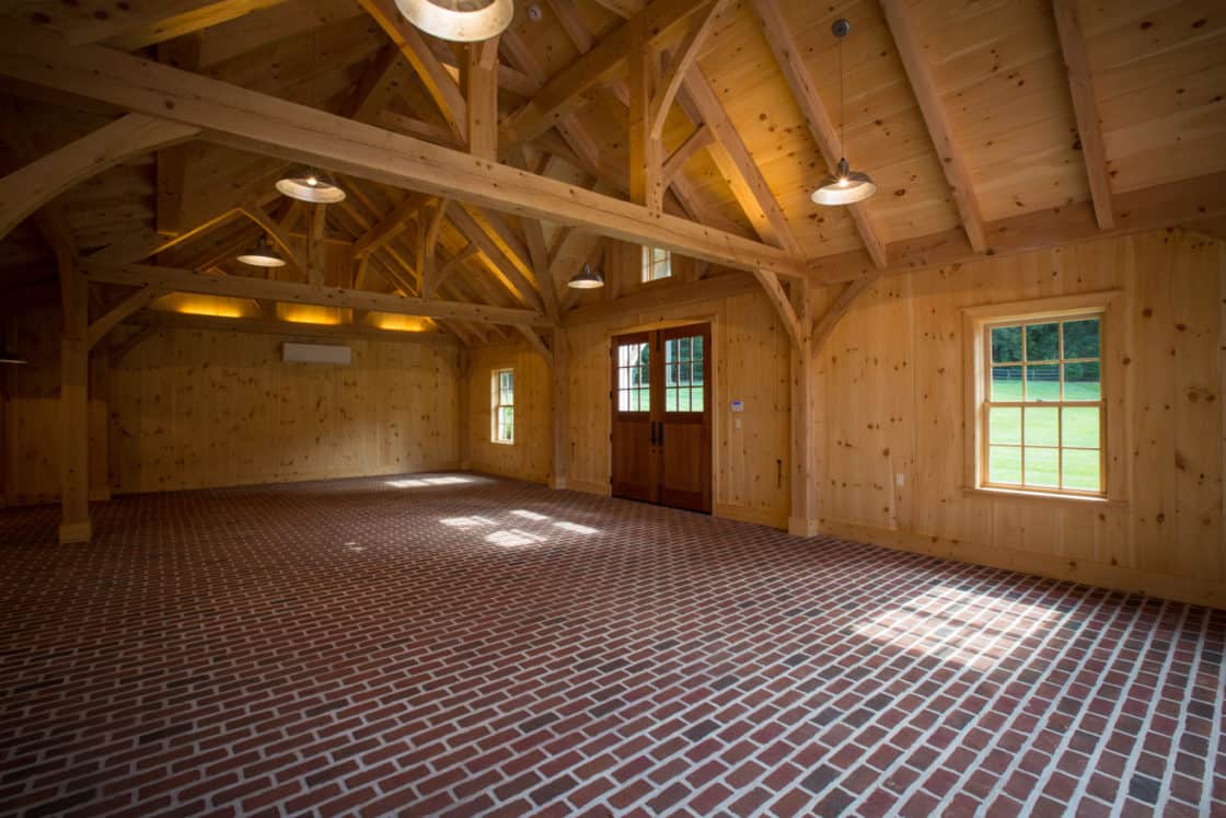 large brick floor inside of timber frame garage