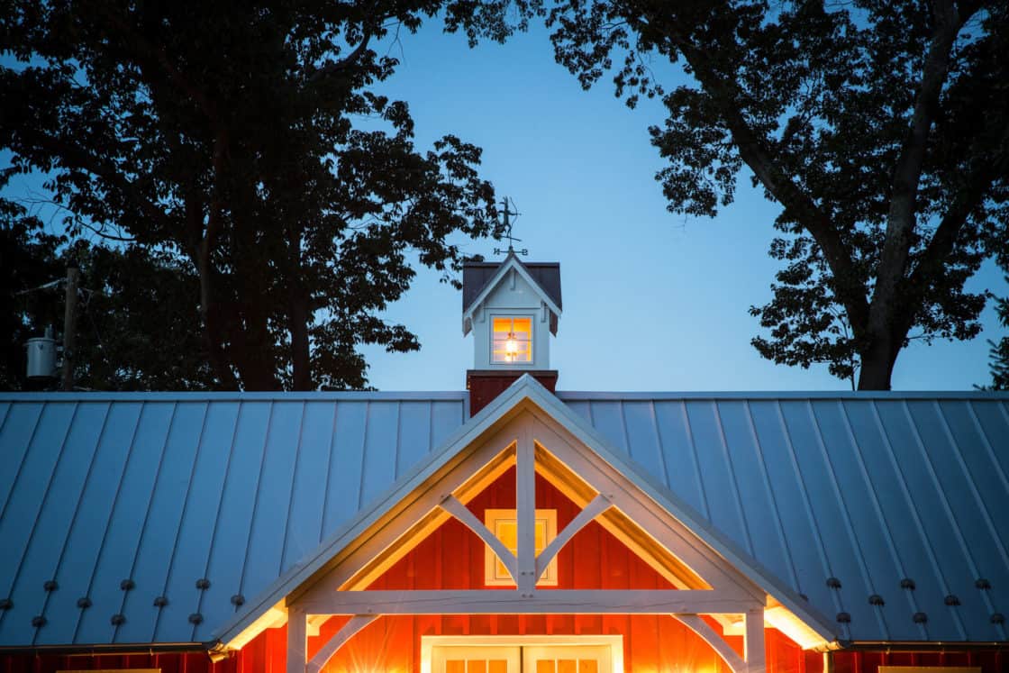 custom garage roof sitting beneath the night sky surrounded by trees