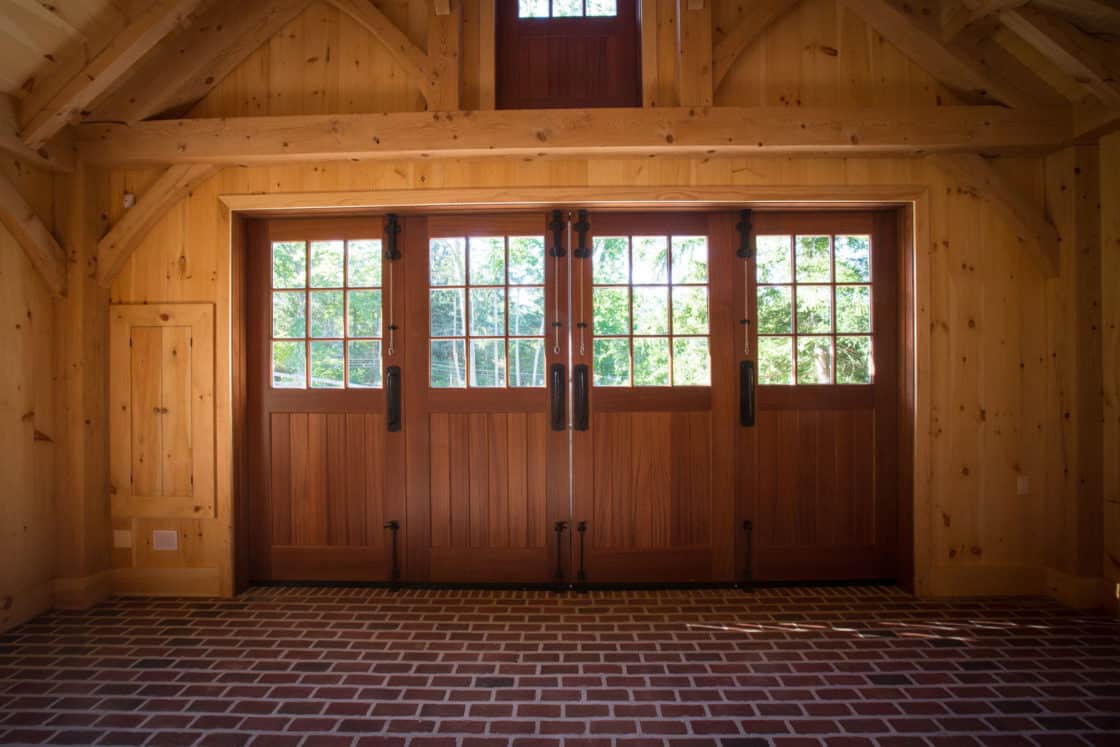 interior view of wooden doors inside of timber frame garage