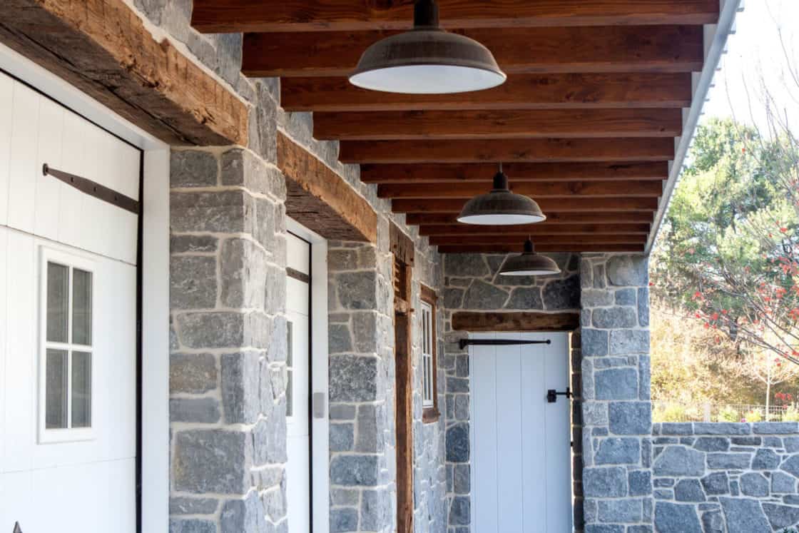 white entry doors on ground level floor of party barn