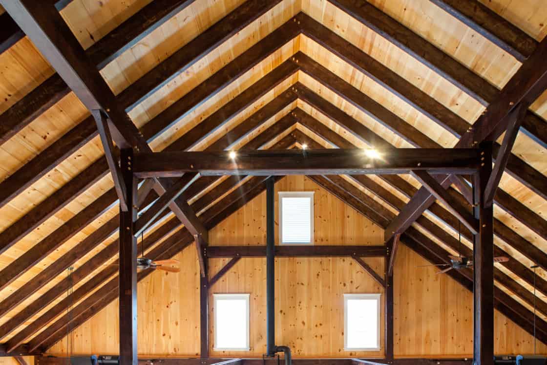 timber truss support beams in the ceiling of party barn