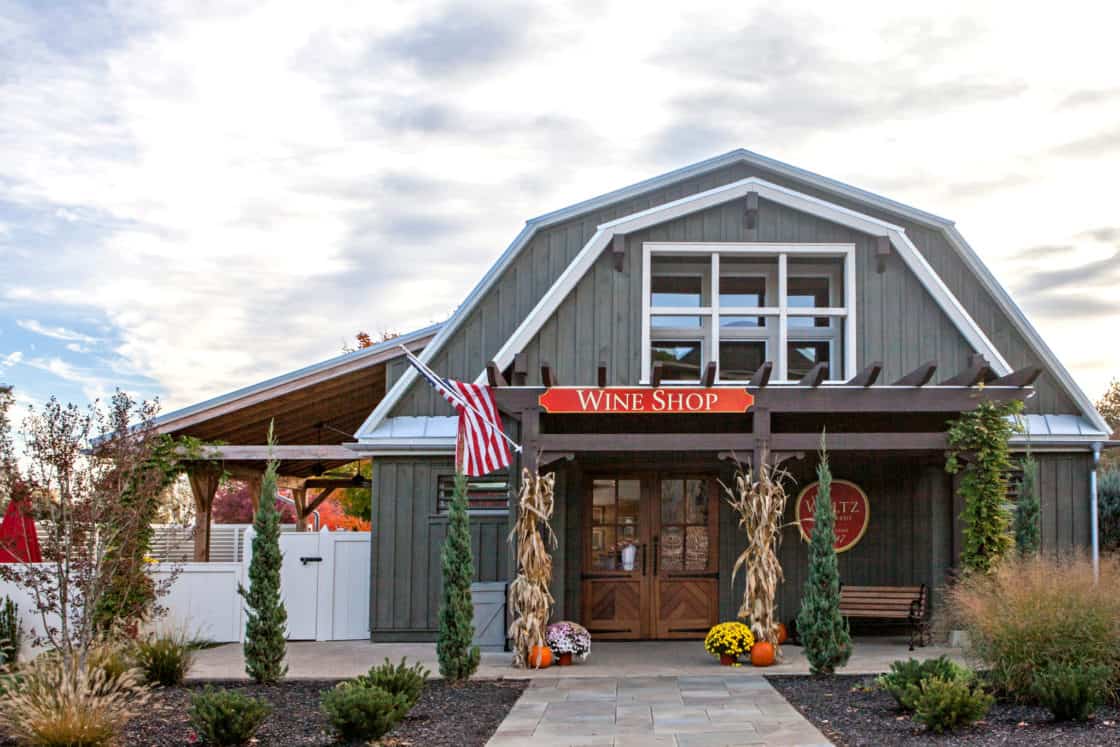 wine shop store front with american flag and fall decorations