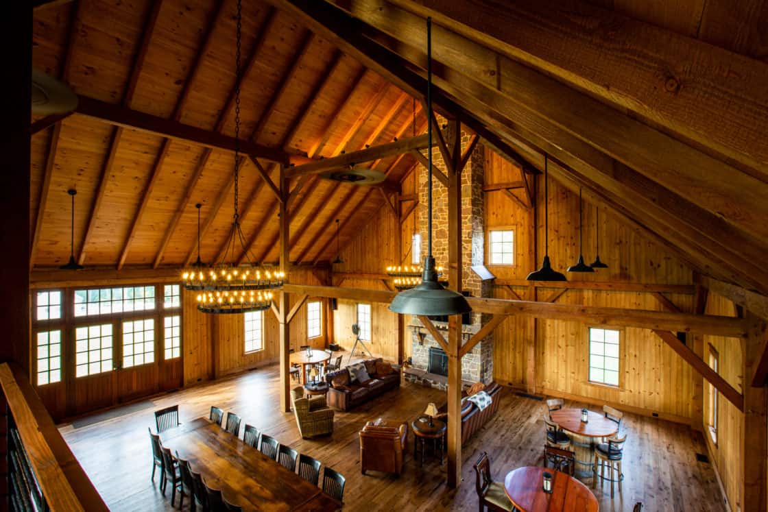 indoor furniture and in open event space with polished wooden floor in party barn