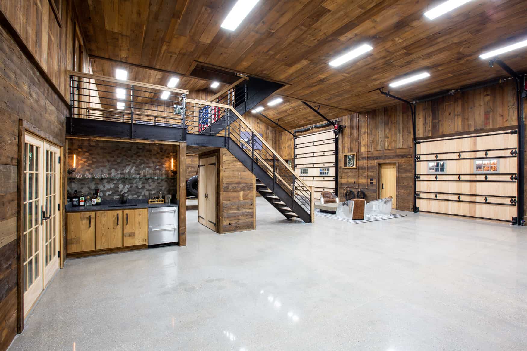 party barn interior with finished wood walls and ceiling along with grey floor