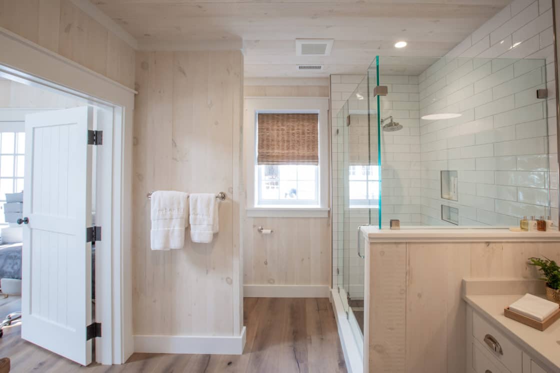 full bathroom with wood finish inside party barn