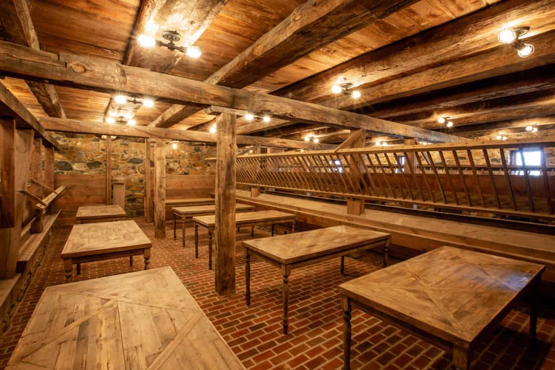 wood tables and beams inside of restored barn in etown pa