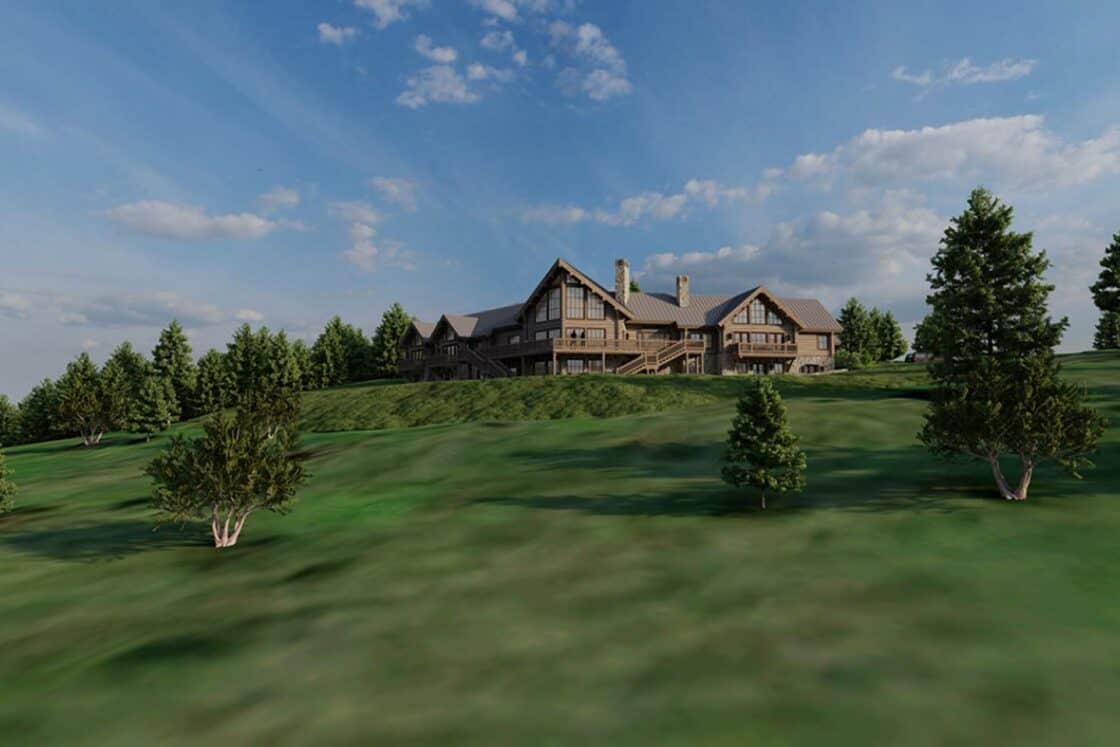 A large wooden luxury home sits atop a grassy hill, surrounded by green trees under a blue sky with scattered clouds. The sunlight casts soft shadows across the rolling landscape.