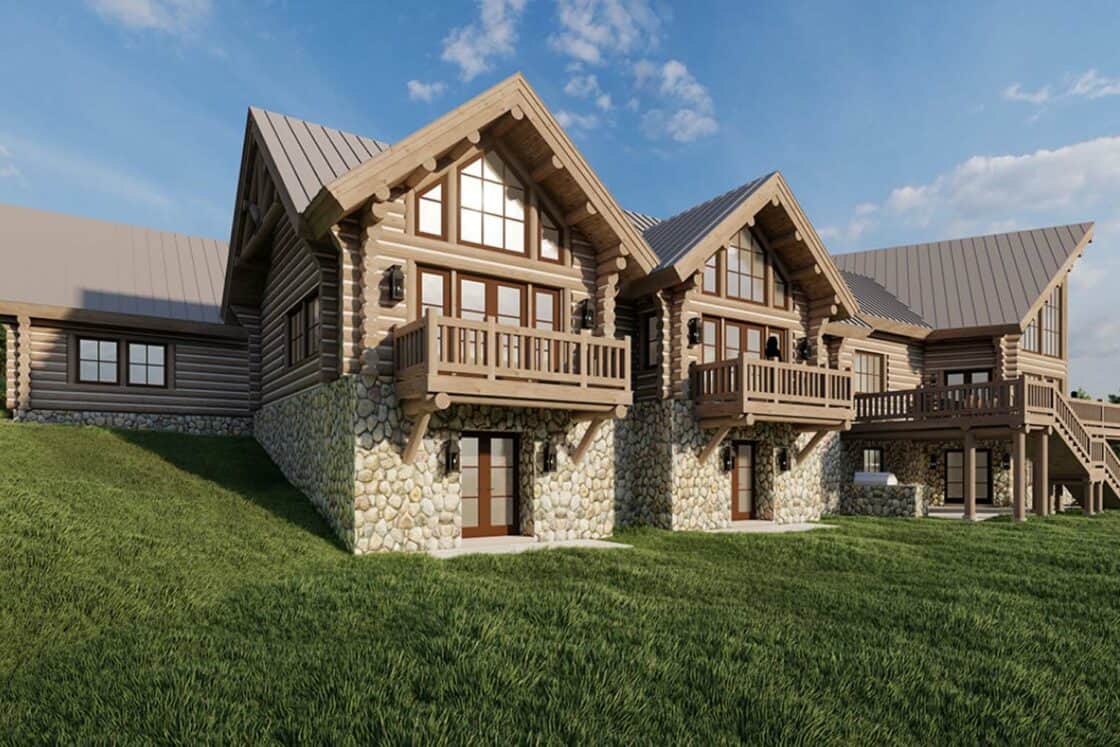 Large log cabin with stone foundation, wooden balconies, and a metal roof. Surrounded by green grass under a blue sky with scattered clouds, this luxury home is nestled in a natural, serene setting.