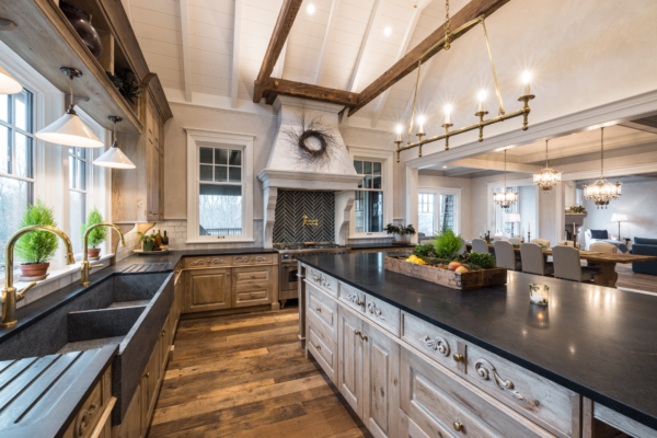 custom luxury kitchen with hard wood floor and light colored ceiling