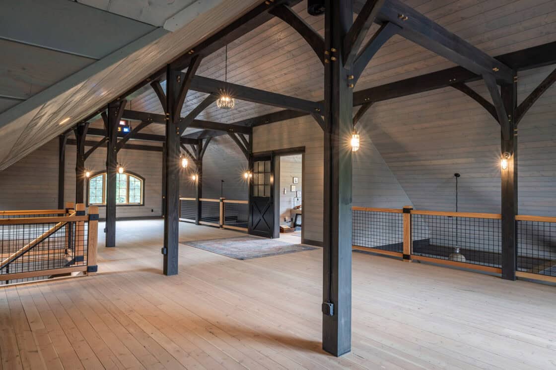 horse barn interior with visible wooden support beams